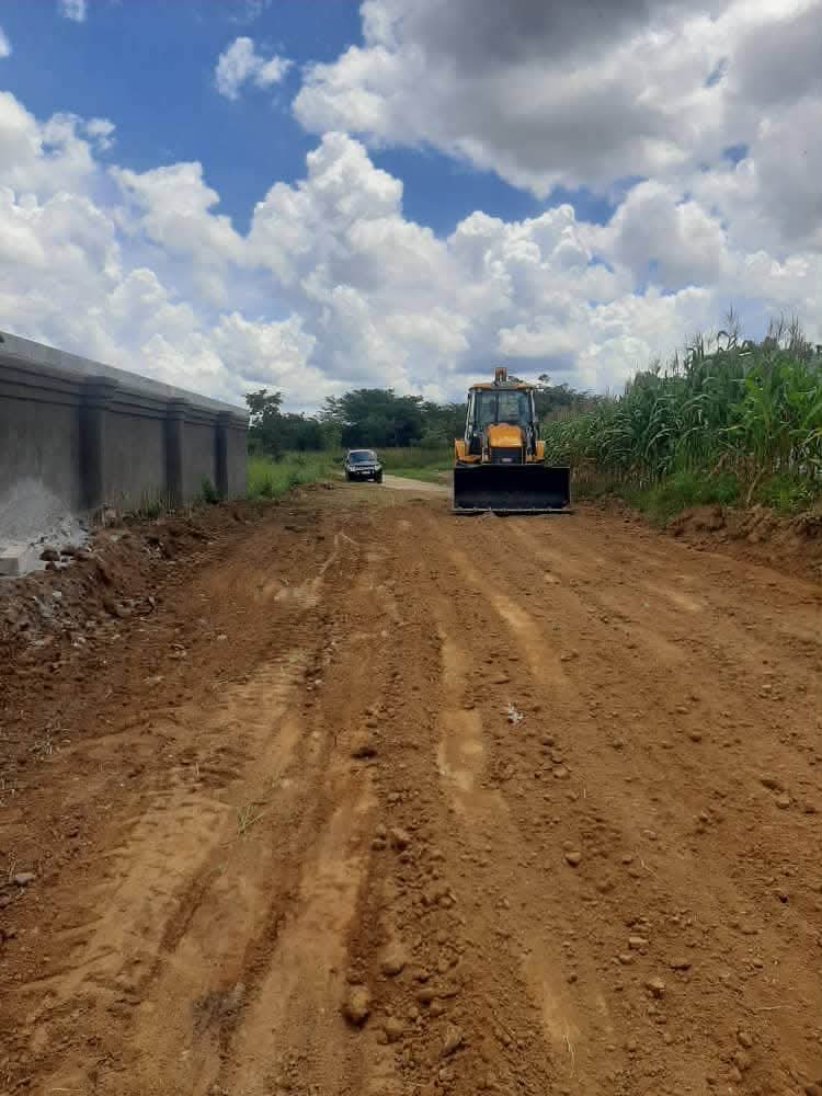 Graded road alongside a boundary wall