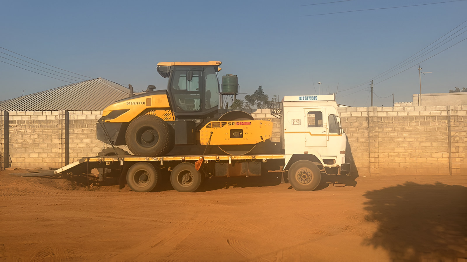 BMR low bed truck transporting heavy equipment