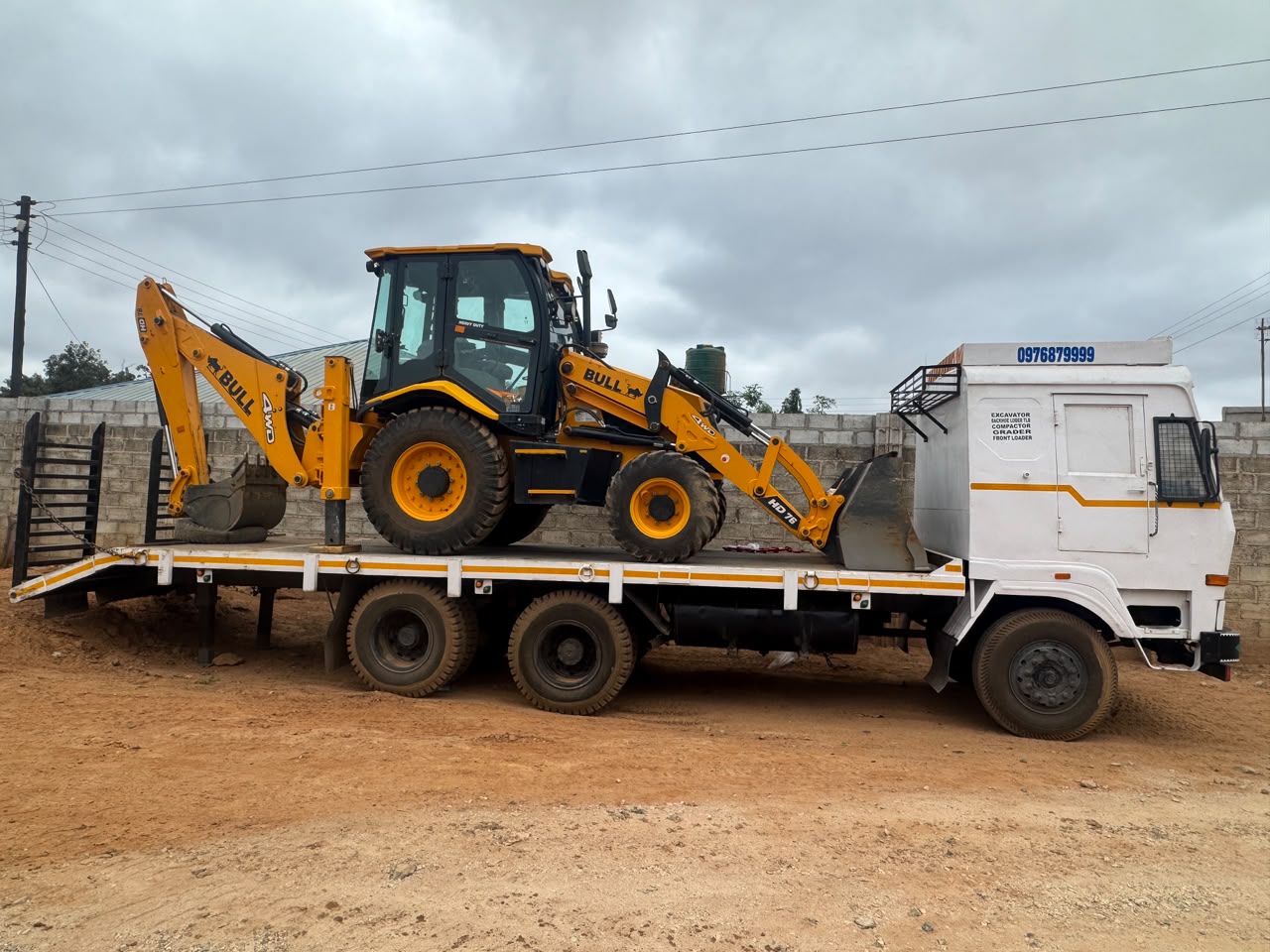 BMR backhoe loader loaded for transport