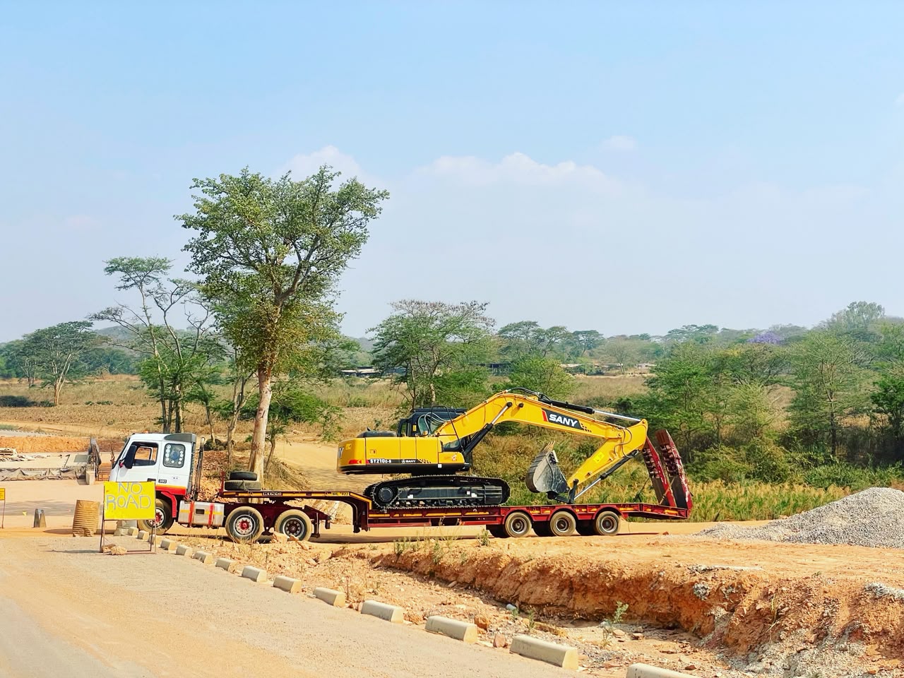BMR excavator loaded on a lowbed truck